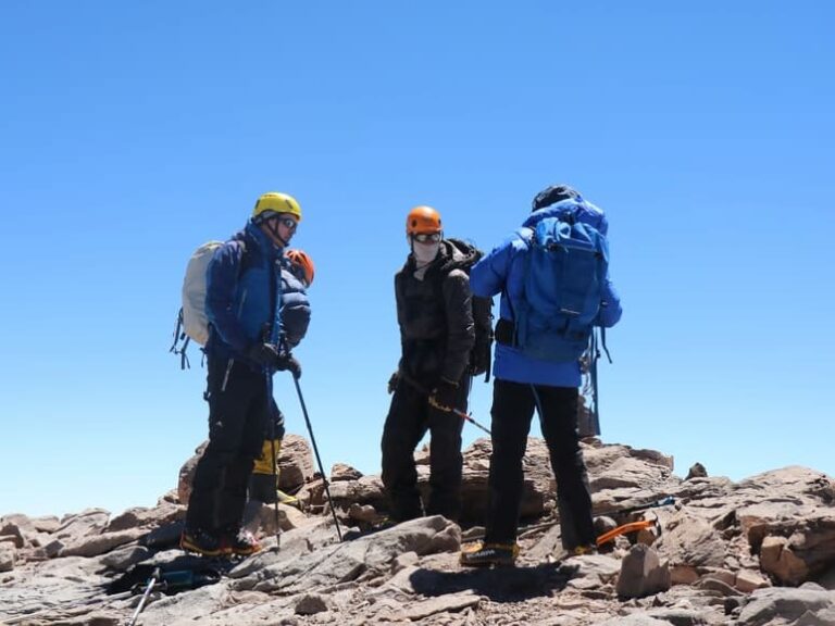 Three People Climbing Mount Kilimanjaro